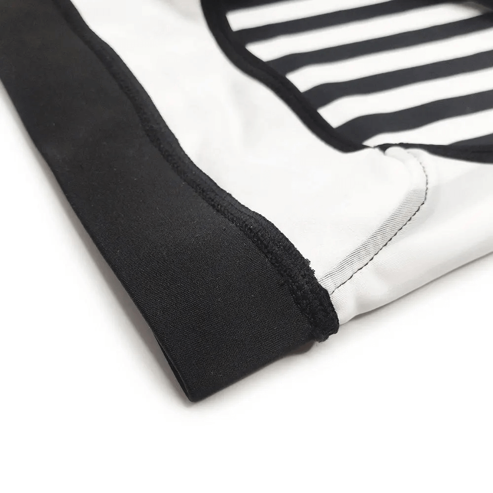 Close-up of black and white striped zebra print swim briefs for men with quick-dry fabric, perfect for beach or pool.